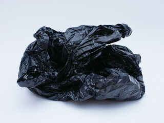 black plastic bag trash isolated on white