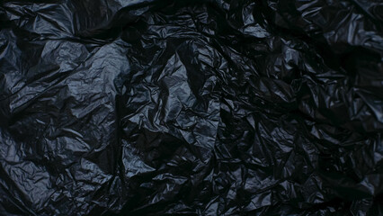 wrinkled black plastic bag texture