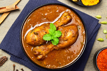Top view of spicy chicken masala curry in bowl