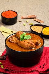 Indian spicy chicken curry in bowl