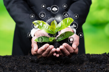 Businessman nurturing plant with eco design icon symbolize commitment to environmental business,...