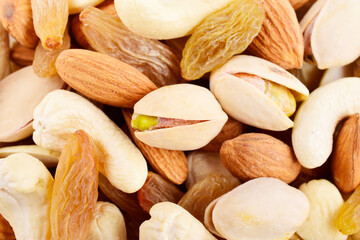 Closeup of pistachio and cashew almond texture background