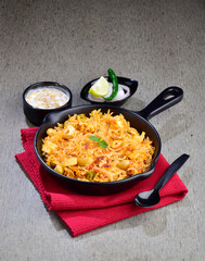 Paneer pulao with raita and onion