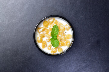 Top view of boondi raita with mint leaves