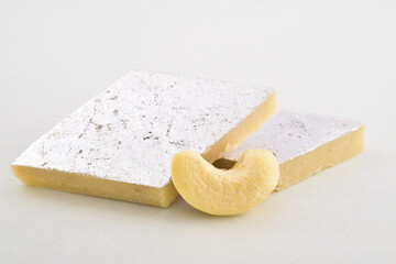 Closeup of kaju katli on white background