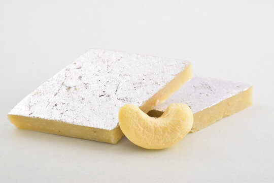 Closeup of kaju katli on white background