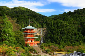 Seianto-ji Temple Pagoda against the backdrop of the Nachi Falls at Nachisan, Nachikatsuura, Wakayama, Japan