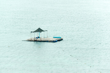 raft in the middle of the sea in the end of summer day 