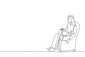 Single one line drawing of young Arabian man sitting on the couch hugging the cat on his thigh. A young man who loves his pet very much. Petting the cat until it sleeps. Continuous line design graphic