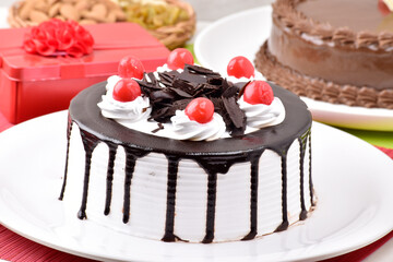 Chocolate vanilla cake with gift, birthday cake