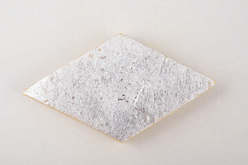 Top view of Kaju katli on white background, indian traditional sweet