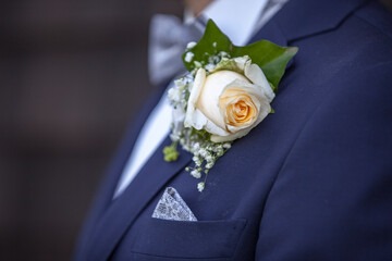 Bridegroom with wedding garment on his suit is ready for the wedding and waiting for the bride