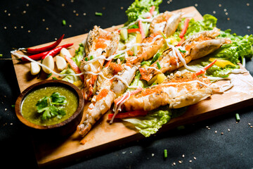 the photo of shrimp salad thaifood with vegetable and seafood sauce
