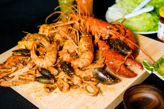 the photo shrimp and seafood cooking with Asian and Chinese style with the vegetable and sauce