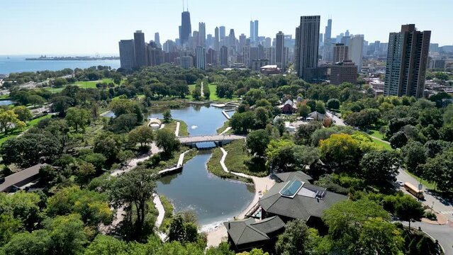 High resolution beautiful panoramic aerial drone 4K video of Lincoln Zoo Chicago and Chicago's skyline and its surrounding area