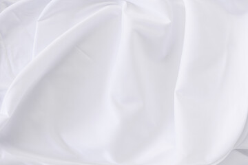 Obraz premium White fabric. luxurious white fabric texture background. Creases of satin, silk and cotton.