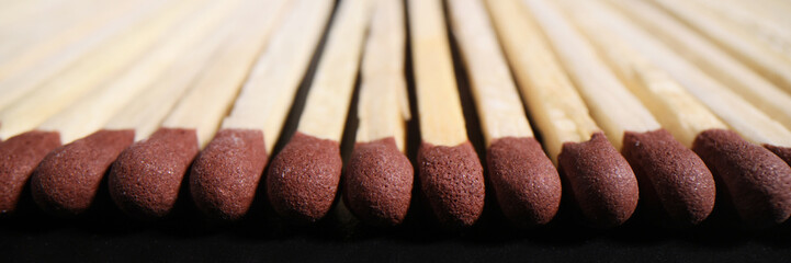 Matches with brown heads in long row ready for lighting up