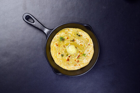 Top view of laccha paratha with butter