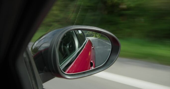 alfa romeo giulia driving looking to back mirror