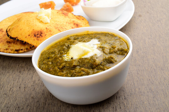 Closeup of sarso ka saag with makkhan in bowl, winter punjabi food