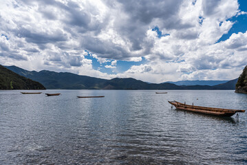 Pig trough boats on the surface of Lugu Lake in China