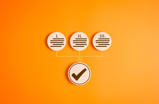 Wooden circle label with a tick check mark for accept Terms of use concept on orange background. Agree to the contract terms and conditions of website or application then go to Next Step progress.