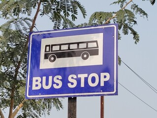 Bus stop sign board with blue background. 