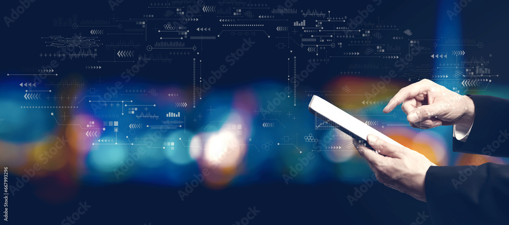 Poster technology screen with businessman using a tablet computer at night