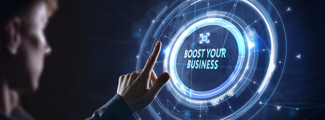 Business, Technology, Internet and network concept. Young businessman shows the word: Boost your...
