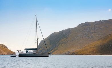 Symi Island, Greece. Greece islands holidays from Rhodos in Aegean Sea. large beautiful yacht in...