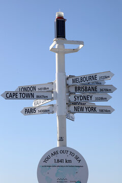 Historical pier in Busselton, Western Australia.  Showing pier, train, buildings, ocean and blue sky