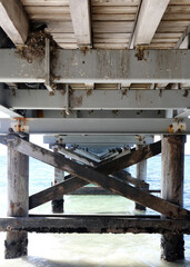 Historical pier in Busselton, Western Australia.  Showing pier, train, buildings, ocean and blue sky