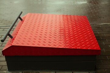 Fire shield at gas station. Red Lid. Storing Sand for Fire Extinguishing.