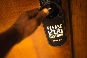 Please do not disturb sign on a door handle