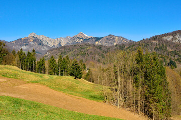 The early spring alpine landscape around the village of Raveo in Carnia, Udine Province, Friuli-Venezia Giulia, north east Italy