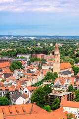Fototapeta na wymiar Panoramic view, aerial skyline of Landshut in Bavaria. Saint Martin cathedral, Martinskirch in old town and cathedrals, architecture, roofs of houses, streets landscape, Landshut, Germany. Vertical