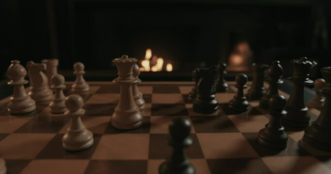 A chess game set in a fireplace atmosphere