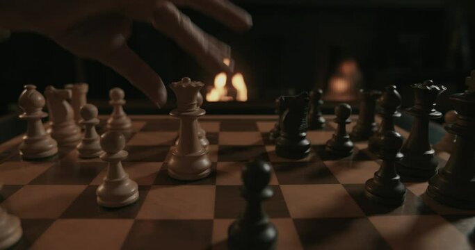 A chess game set in a fireplace atmosphere