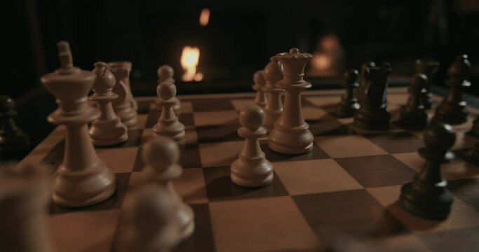 A chess game set in a fireplace atmosphere