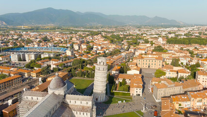 Fototapeta na wymiar Pisa, Italy. The famous Leaning Tower and Pisa Cathedral in Piazza dei Miracoli. Summer. Evening hours, Aerial View