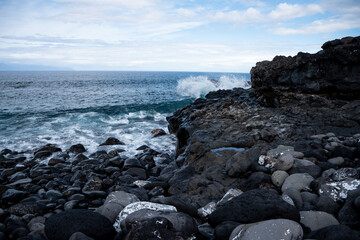 Fototapeta na wymiar Stone coast of Tenerife, ocean, waves in Tenerife, stone beaches of Tenerife
