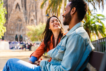 Multiracial beautiful happy couple of lovers dating at Sagrada Familia, Barcelona - Multiethnic...