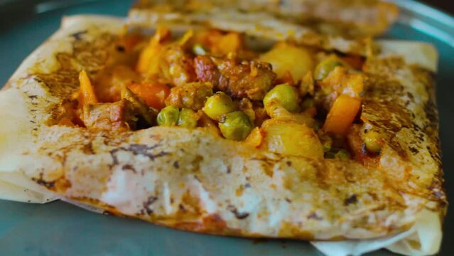 Kagit kebabi is made from tomatoes, peppers, minced meat and spices. It is made using baking paper in an oven to trap the juices and flavours inside.
Turkish kebab peculiar to Hatay.
