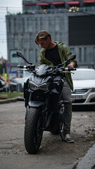 Fototapeta na wymiar handsome man on a motorbike