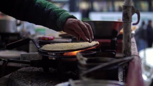 Aloo paratha, a popular dish in north India being prepared by a street vendor near Shimla, India.