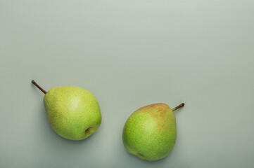 Fresh green pears on olive background.Organic healthy food concept.Natural dessert.Fruit background.