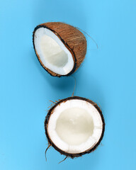 Broken coconut on a blue background