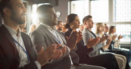 African American Man Sitting in Crowded Auditorium at a Tech Conference. Black Businessman...