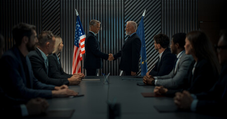 High-Level Political Forum: Two Caucasian Male Politicians From United States And European Union Greeting Each Other With Handshake. Beginning Of Meeting Between World Leaders With Diverse Delegations - obrazy, fototapety, plakaty