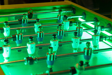 table soccer game illuminated by led strips. Typical nightlife of the Spanish bars. Close up